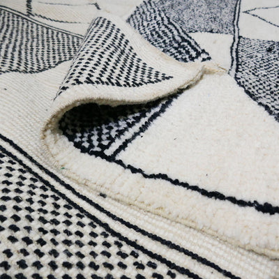 genuine beni ouarain handmade abstract wool moroccan rug berber neutral minimalist modern black and cream design carpet